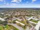 Expansive community featuring multiple buildings surrounded by mature trees and ample parking at 2280 World Parkway Blvd # 34, Clearwater, FL 33763