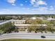 Low-rise apartment complex featuring ample parking, and mature tree landscaping at 2280 World Parkway Blvd # 34, Clearwater, FL 33763