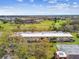 Low-rise apartments and condos near a lush green golf course with mature trees at 2280 World Parkway Blvd # 34, Clearwater, FL 33763