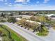 Low-rise condominium buildings featuring assigned parking, and mature tree landscaping at 2280 World Parkway Blvd # 34, Clearwater, FL 33763