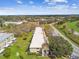 Low-rise condos near a golf course and waterway with a lush green tree canopy at 2280 World Parkway Blvd # 34, Clearwater, FL 33763