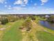 Scenic aerial view of the community's green common spaces with a pond at 2280 World Parkway Blvd # 34, Clearwater, FL 33763