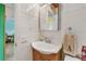 Tight shot of a tiled bathroom featuring a sink and other various bathroom elements at 2280 World Parkway Blvd # 34, Clearwater, FL 33763