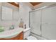 Tidy bathroom featuring a tiled shower with glass doors and a clean white sink at 2280 World Parkway Blvd # 34, Clearwater, FL 33763