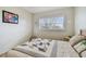 Bright bedroom with a window view and coastal-themed decor creates a relaxing and inviting space at 2280 World Parkway Blvd # 34, Clearwater, FL 33763