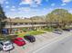 Exterior view of a multi-Gathering residential building with parking spaces and manicured green spaces at 2280 World Parkway Blvd # 34, Clearwater, FL 33763