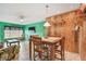 Dining area adjacent to living room, featuring a tile floor and a four-chair wood dining set at 2280 World Parkway Blvd # 34, Clearwater, FL 33763