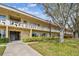 Well-maintained condo building with lush landscaping, offering a serene community setting at 2280 World Parkway Blvd # 34, Clearwater, FL 33763