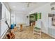 Florida Room featuring ceiling fan, table, seating, guitar and lots of light at 2280 World Parkway Blvd # 34, Clearwater, FL 33763