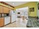 Bright kitchen with tile floors, cabinetry, and a view to the Gathering room at 2280 World Parkway Blvd # 34, Clearwater, FL 33763