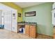 Cozy kitchenette featuring tiled countertops, wooden cabinets, and bright yellow/green walls at 2280 World Parkway Blvd # 34, Clearwater, FL 33763