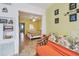 An open living area offering a glimpse into the bedroom at 2280 World Parkway Blvd # 34, Clearwater, FL 33763