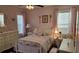 Charming bedroom featuring a white wood bed frame and dresser with unique and lovely decorative touches at 249 Iron Age St., Safety Harbor, FL 34695