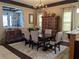 The dining room showcases a statement chandelier and a decorative wrought iron design at 249 Iron Age St., Safety Harbor, FL 34695