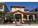Charming two-story home featuring a terracotta roof, arched entry, and manicured landscaping at 249 Iron Age St., Safety Harbor, FL 34695
