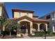 Charming two-story home featuring a terracotta roof, arched entry, and manicured landscaping at 249 Iron Age St., Safety Harbor, FL 34695