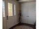 Elegant foyer with decorative glass door, coat rack, and closet, showcasing a welcoming entryway at 249 Iron Age St., Safety Harbor, FL 34695