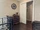 Hallway with hardwood floors leads to a bright room with a sliding door and decorative touches at 249 Iron Age St., Safety Harbor, FL 34695