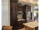 Close-up of the kitchen with stainless steel appliances and dark wood cabinets at 249 Iron Age St., Safety Harbor, FL 34695