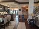 Spacious open kitchen featuring wooden cabinetry, granite countertops, and a breakfast bar at 249 Iron Age St., Safety Harbor, FL 34695