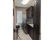 Laundry room with neutral paint, modern washer and dryer, and cabinet storage at 249 Iron Age St., Safety Harbor, FL 34695