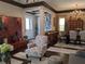Open-concept living and dining area featuring hardwood floors, elegant decor, and ample natural light at 249 Iron Age St., Safety Harbor, FL 34695