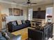 A living room with leather couches, lamps and hanging decorations at 249 Iron Age St., Safety Harbor, FL 34695