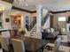 Open-concept living space with dining room, staircase, wet bar and living room at 249 Iron Age St., Safety Harbor, FL 34695