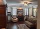 Spacious main bedroom with hardwood floors, sitting area, fireplace, and elegant decor at 249 Iron Age St., Safety Harbor, FL 34695