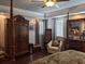 Hardwood floors and a fireplace adds charm to the spacious main bedroom with natural lighting at 249 Iron Age St., Safety Harbor, FL 34695