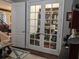Bright office with glass paneled French doors for privacy and natural light, perfect work-from-home setup at 249 Iron Age St., Safety Harbor, FL 34695