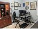 Inviting office with glass desk, modern lighting, neutral walls, and wood cabinet for professional, productive space at 249 Iron Age St., Safety Harbor, FL 34695