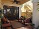 Relaxing covered patio with outdoor seating area, ceiling fan and lush greenery at 249 Iron Age St., Safety Harbor, FL 34695