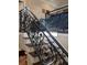 Elegant staircase features wrought iron railing and stained wood steps at 249 Iron Age St., Safety Harbor, FL 34695