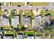 Aerial view of the property showcases its location within a neighborhood and proximity to amenities at 2491 Coronado Way, Dunedin, FL 34698