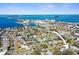 Scenic aerial shot showcasing a coastal community with homes near the ocean, offering a serene residential setting at 2491 Coronado Way, Dunedin, FL 34698