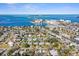 Panoramic aerial view of a charming residential neighborhood near the ocean, showcasing its coastal community appeal at 2491 Coronado Way, Dunedin, FL 34698