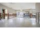 Spacious living room with walls partially removed, light fixtures, and a glass patio door at 2491 Coronado Way, Dunedin, FL 34698