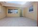 Covered patio area provides an inviting outdoor space for relaxation and entertaining at 2491 Coronado Way, Dunedin, FL 34698