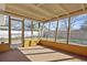Relaxing screened porch with views of the backyard and surrounding greenery at 2491 Coronado Way, Dunedin, FL 34698