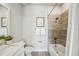 This is a bright bathroom featuring a granite countertop, a shower, and sleek gray flooring at 2511 N Grady Ave # 41, Tampa, FL 33607