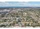 Aerial view of single Gathering homes, mature trees, lawns, and a street in a residential neighborhood at 2851 66Th N Way, St Petersburg, FL 33710