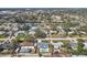 Aerial view of a neighborhood with many single Gathering homes, some with pools, and mature trees at 2851 66Th N Way, St Petersburg, FL 33710