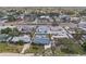 An aerial view of single-Gathering homes, lawns, mature trees and a street in a residential neighborhood at 2851 66Th N Way, St Petersburg, FL 33710