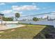 This expansive backyard is fully fenced and has a pool and lush landscaping, making it an outdoor retreat at 2851 66Th N Way, St Petersburg, FL 33710