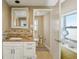 This renovated bathroom features a decorative backsplash, modern vanity, and updated fixtures at 2851 66Th N Way, St Petersburg, FL 33710