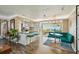 Bright kitchen and dining space featuring bar seating, modern lighting, and comfortable seating at 2851 66Th N Way, St Petersburg, FL 33710