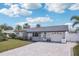 Charming single-story home featuring a well-manicured lawn, a driveway and an attached one-car garage at 2851 66Th N Way, St Petersburg, FL 33710