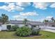 Charming single-story home with fresh landscaping, and a gray roof at 2851 66Th N Way, St Petersburg, FL 33710