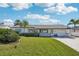 Charming single-story home with manicured lawn, updated exterior paint, and a welcoming entryway at 2851 66Th N Way, St Petersburg, FL 33710